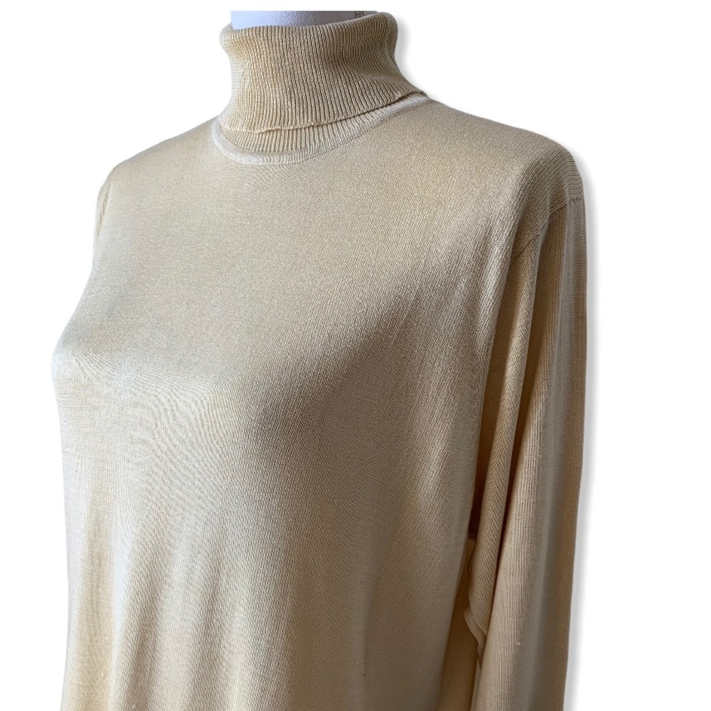Elegant Cream Herman Geist Silk Turtleneck